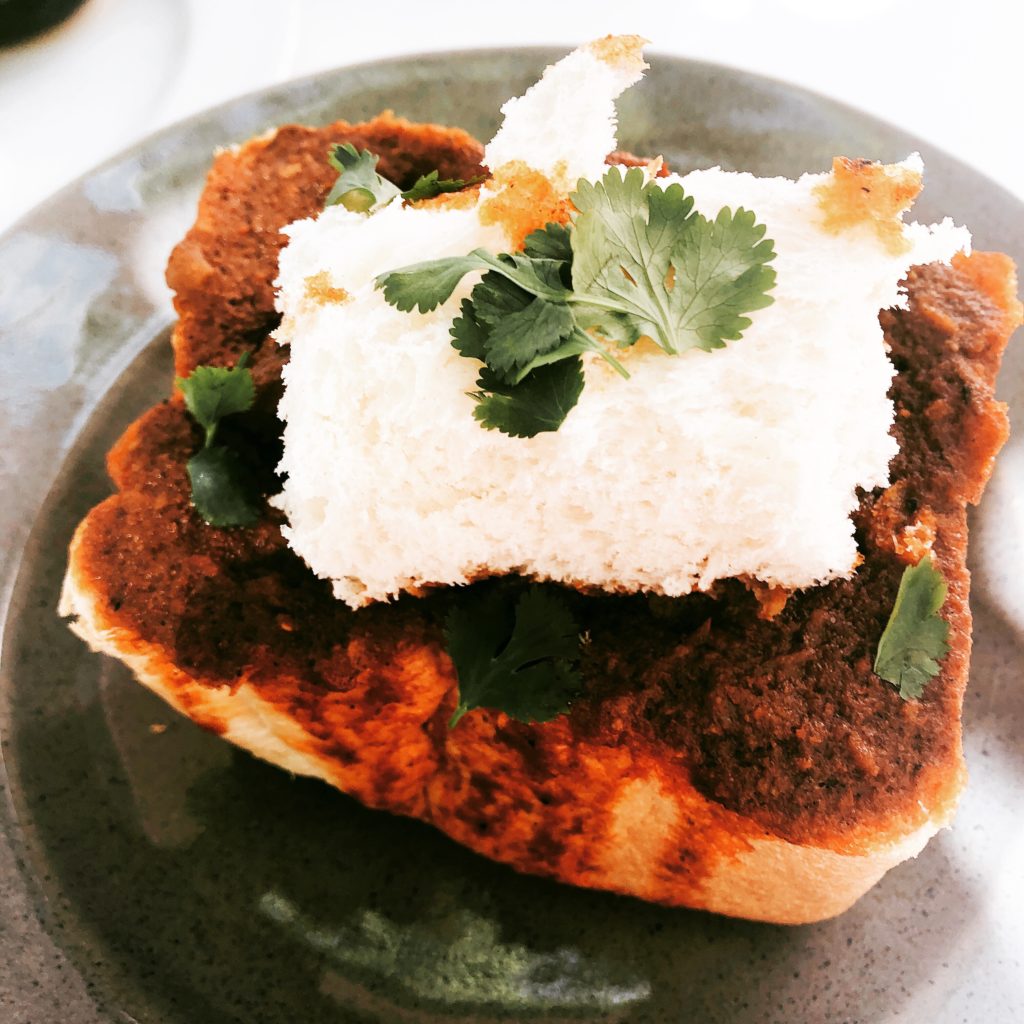 Bunny Chows are a traditional South African dish where a quarter or a half loaf of bread is hollowed out and filled with curry. The inside scooped bread is often put on top so that you can use it to mop up the gravy